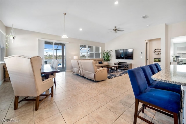 tiled living room with ceiling fan and lofted ceiling