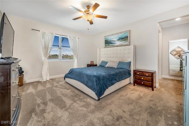 bedroom with ceiling fan and light colored carpet