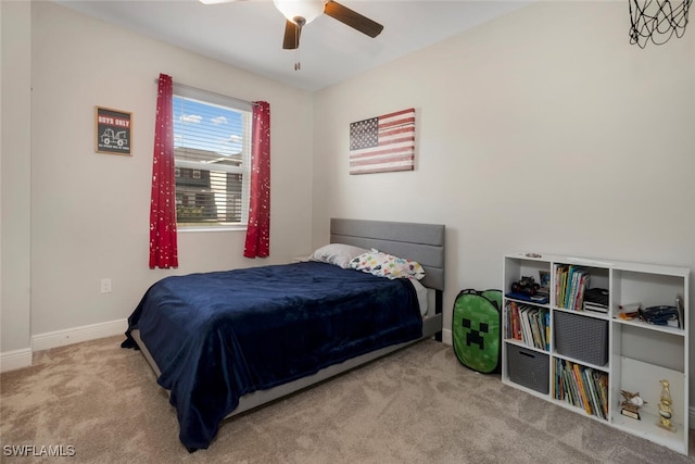 bedroom featuring ceiling fan and light carpet