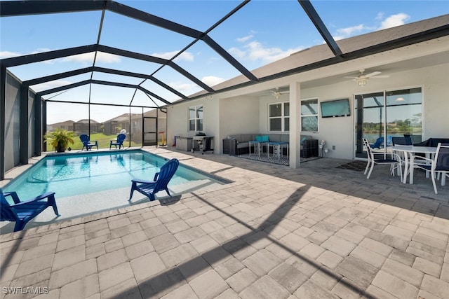 view of swimming pool with a lanai, an outdoor living space, ceiling fan, and a patio area