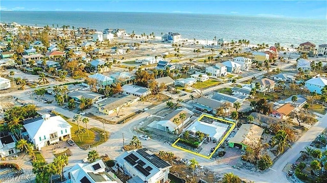 bird's eye view featuring a water view and a residential view