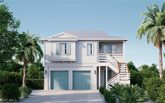 coastal home featuring an attached garage, stairway, metal roof, and concrete driveway