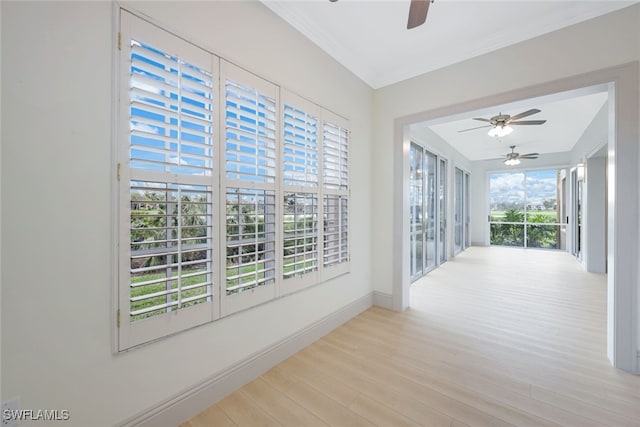 26831 Wyndhurst Ct Unit 101, Bonita Springs, FL 34134 - unfurnished sunroom with crown molding, baseboards, and wood finished floors