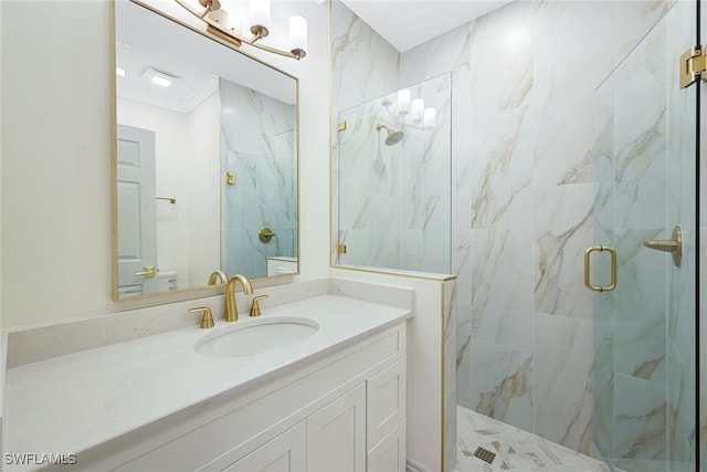 bathroom with toilet, a shower with door, ornamental molding, and vanity