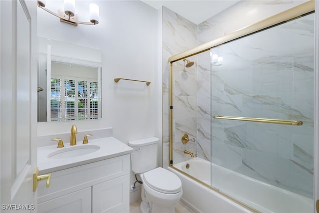 full bathroom featuring toilet, enclosed tub / shower combo, and vanity