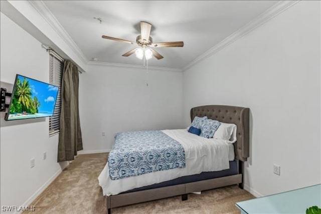 bedroom featuring ceiling fan, light colored carpet, and crown molding