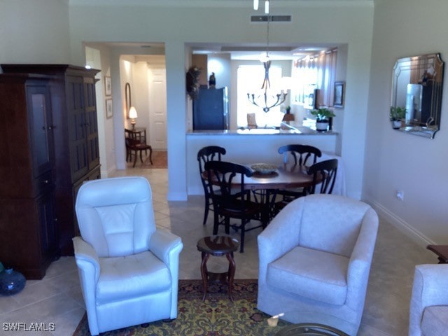 living room with tile patterned flooring