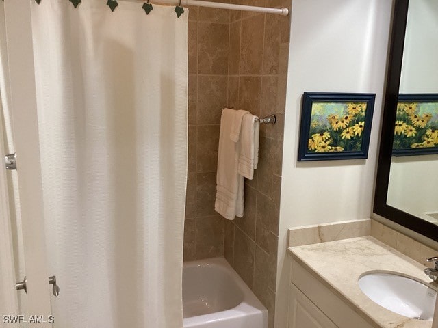 bathroom featuring vanity and shower / bath combo