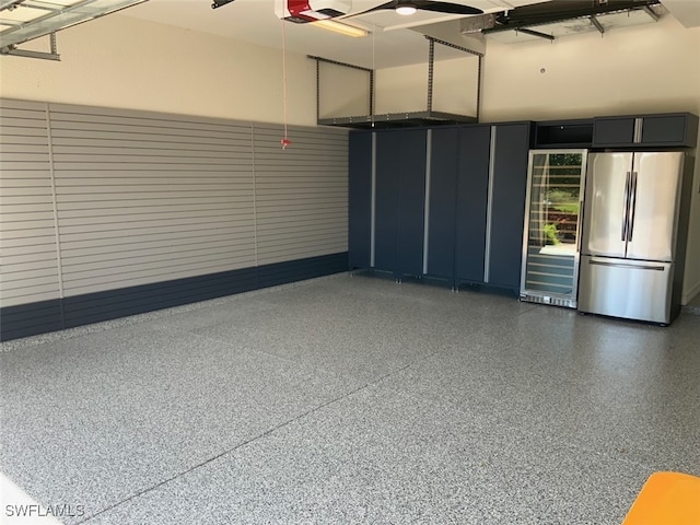 garage with stainless steel fridge