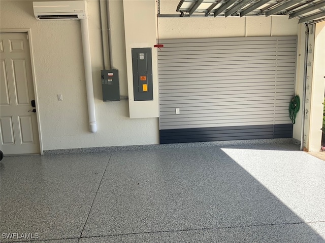 garage featuring electric panel and a wall mounted air conditioner