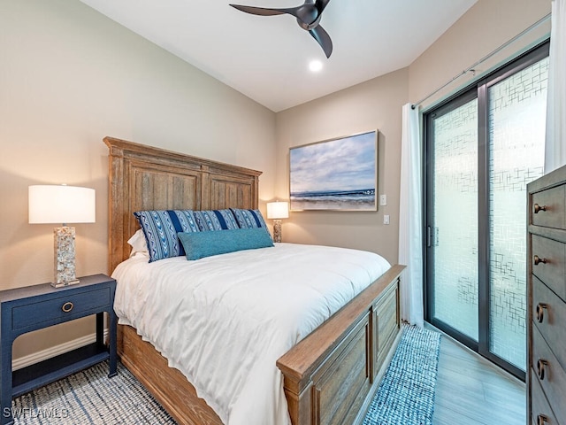 bedroom featuring light hardwood / wood-style floors, access to exterior, and ceiling fan