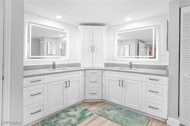 bathroom with vanity and hardwood / wood-style flooring