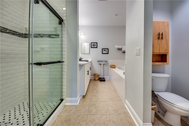 full bathroom featuring tile patterned flooring, shower with separate bathtub, vanity, and toilet