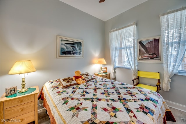 bedroom featuring wood-type flooring and ceiling fan