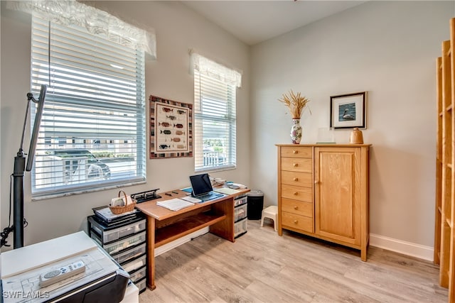 office with light hardwood / wood-style flooring