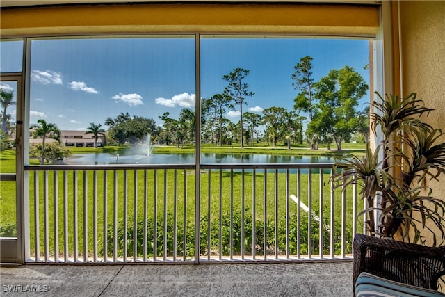 unfurnished sunroom with a water view