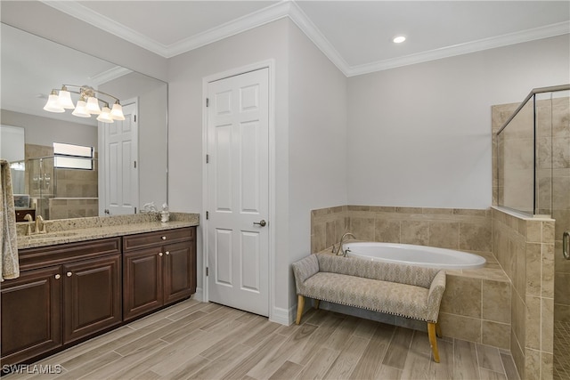 bathroom with vanity, hardwood / wood-style flooring, independent shower and bath, and crown molding