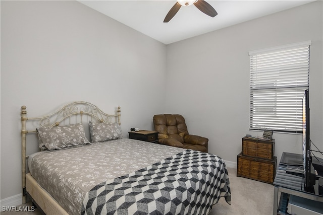 bedroom with ceiling fan and light colored carpet