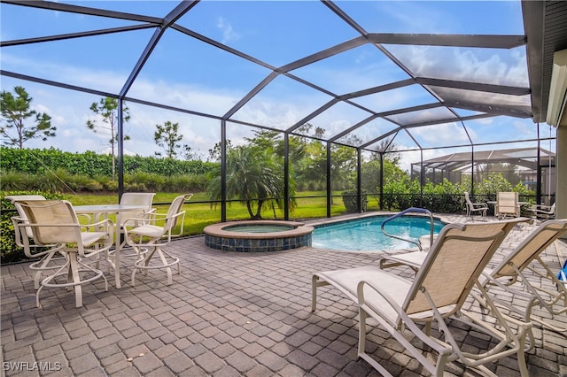 view of swimming pool featuring a lanai and a patio area