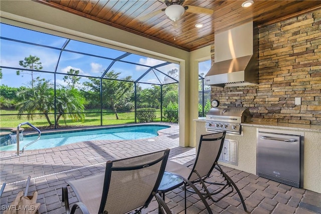 outdoor pool with an outdoor kitchen, a ceiling fan, a lanai, a grill, and a patio area