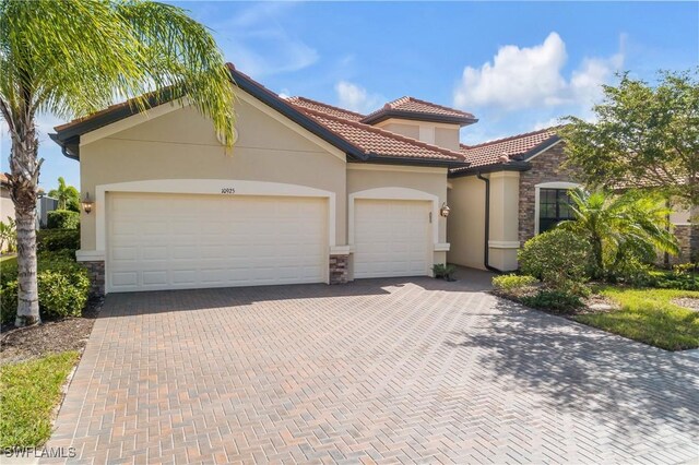 mediterranean / spanish-style house featuring a garage