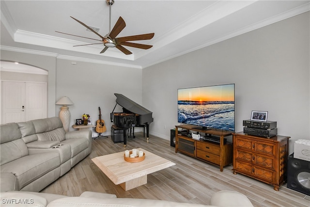 living room with light hardwood / wood-style flooring and ornamental molding