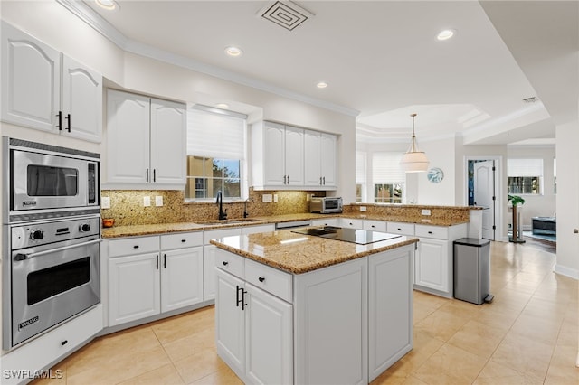 11160 Harbour Yacht Ct Unit C, Fort Myers, FL 33908 - kitchen featuring decorative backsplash, appliances with stainless steel finishes, a sink, a peninsula, and ornamental molding