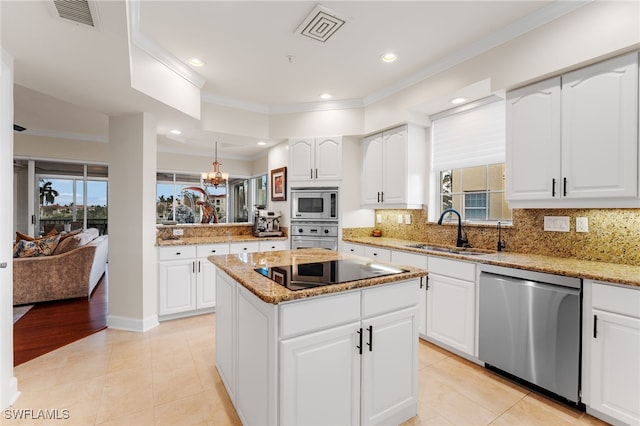 11160 Harbour Yacht Ct Unit C, Fort Myers, FL 33908 - kitchen with appliances with stainless steel finishes, ornamental molding, a sink, and visible vents