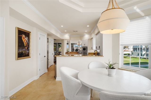 11160 Harbour Yacht Ct Unit C, Fort Myers, FL 33908 - dining room featuring baseboards, ornamental molding, a tray ceiling, and recessed lighting