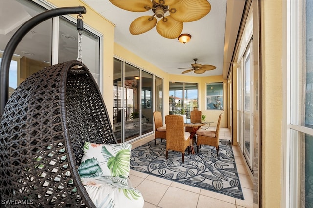 11160 Harbour Yacht Ct Unit C, Fort Myers, FL 33908 - sunroom / solarium with a ceiling fan, tile patterned flooring, and outdoor dining space