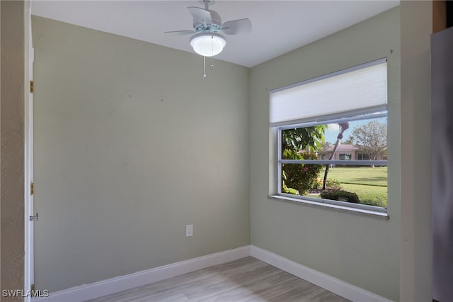 unfurnished room with ceiling fan and light hardwood / wood-style flooring