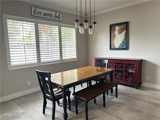 dining space with ornamental molding