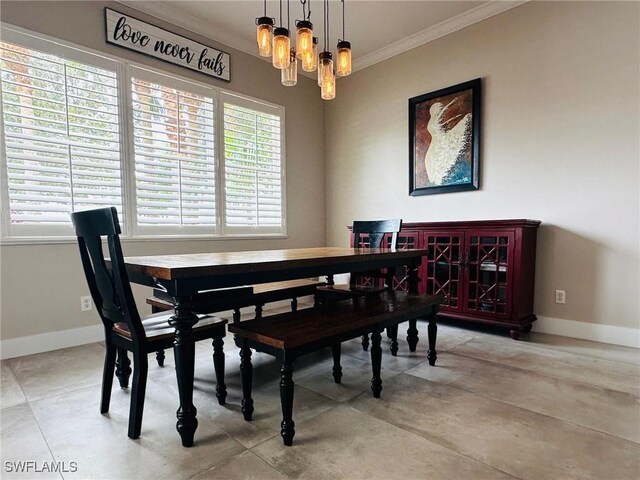 dining room featuring an inviting chandelier and crown molding