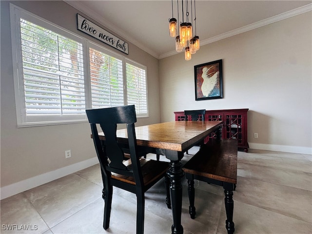 tiled dining area with an inviting chandelier and crown molding