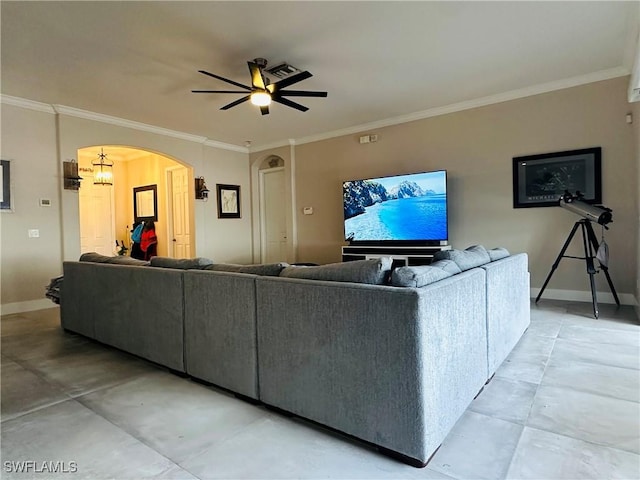 living room with ornamental molding and ceiling fan