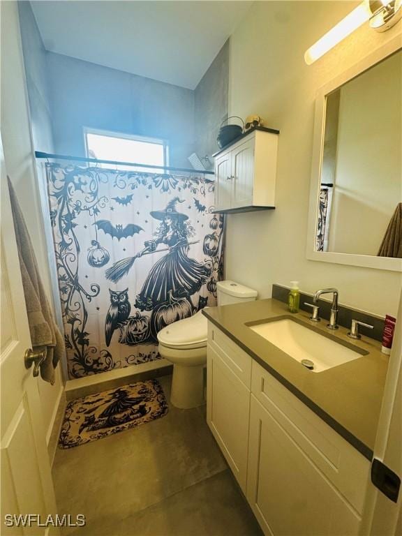 bathroom with walk in shower, vanity, and toilet