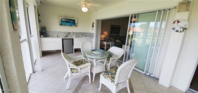 tiled dining area with ceiling fan