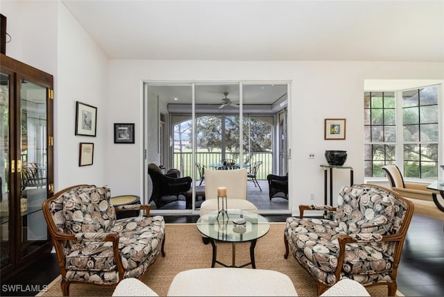 living room featuring a sunroom and wood finished floors