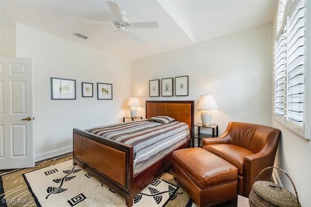 bedroom featuring baseboards, visible vents, and a ceiling fan