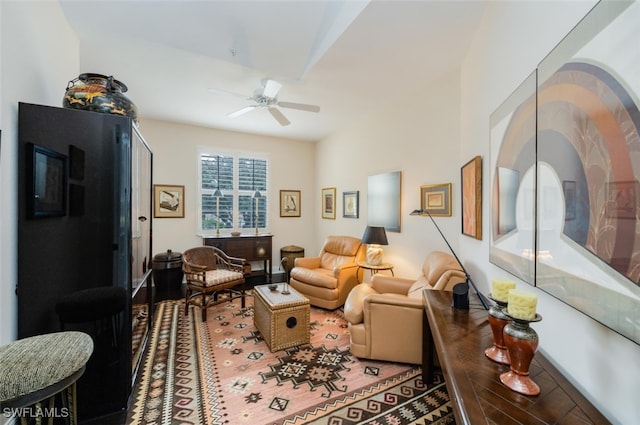 living area featuring ceiling fan