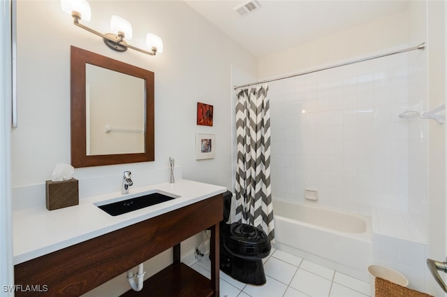 full bath featuring visible vents, toilet, shower / bath combo with shower curtain, vanity, and tile patterned floors