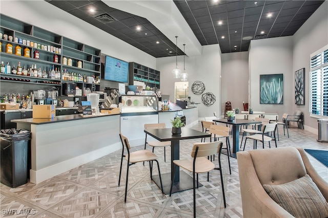 dining space featuring a high ceiling