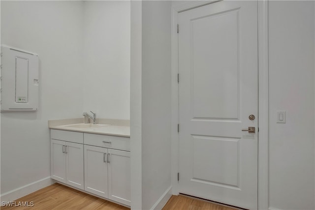 bathroom with vanity and wood-type flooring