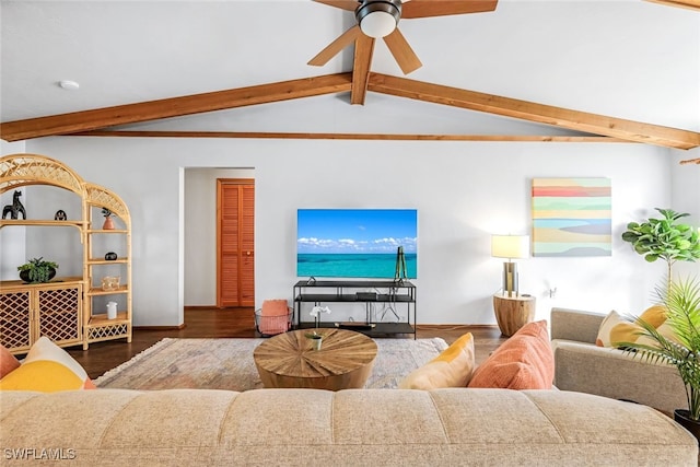 living room with vaulted ceiling with beams, ceiling fan, and dark wood-type flooring