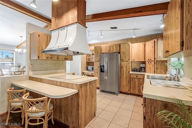 kitchen with beam ceiling, sink, stainless steel appliances, premium range hood, and kitchen peninsula