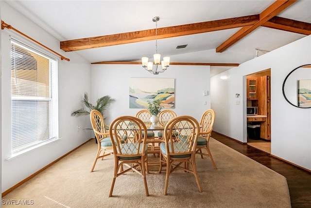 dining space with vaulted ceiling with beams, dark wood-type flooring, and an inviting chandelier