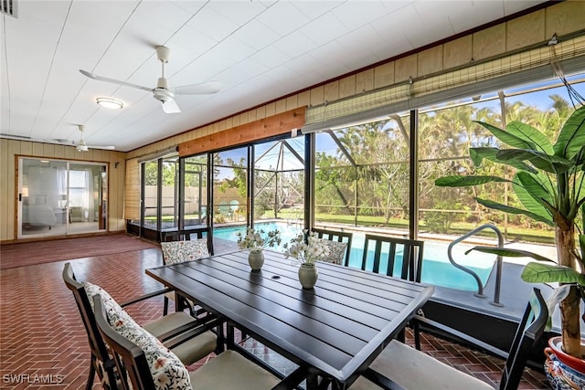 sunroom featuring ceiling fan