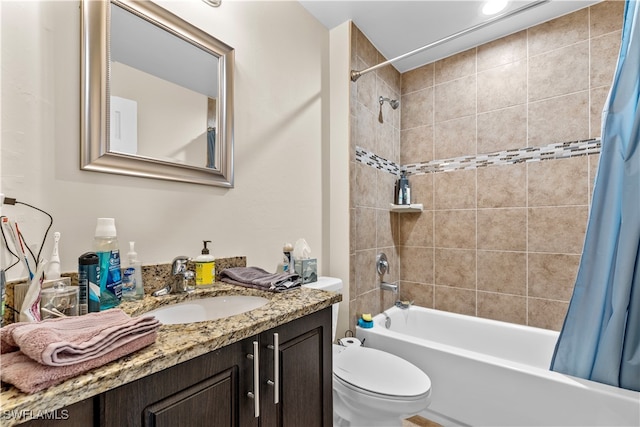 full bathroom featuring vanity, shower / bath combination with curtain, and toilet