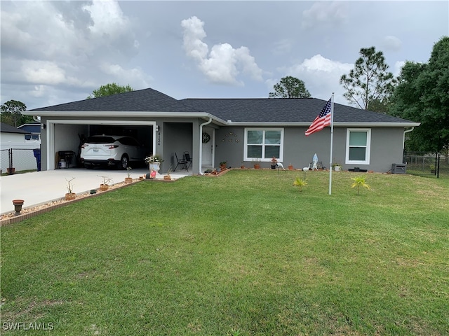 single story home with a garage and a front lawn