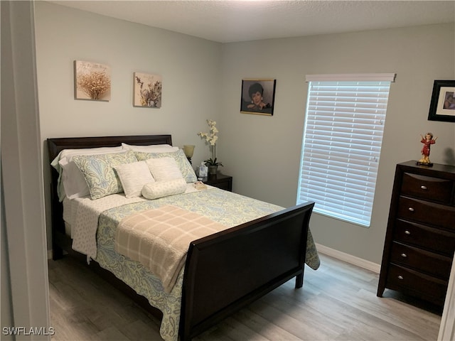 bedroom featuring light hardwood / wood-style flooring